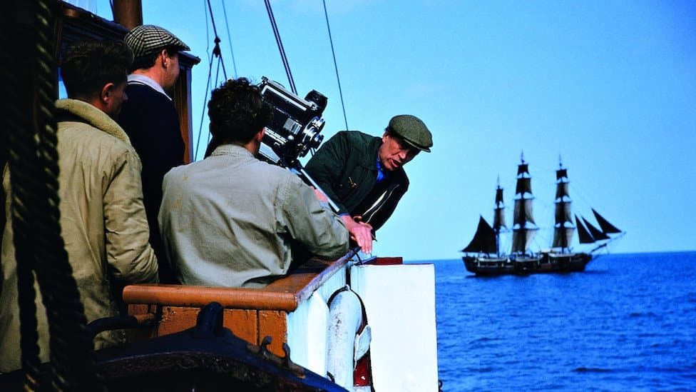 Director John Huston (1906 - 1987) sets up a shot for the film 'Moby Dick', circa 1956.