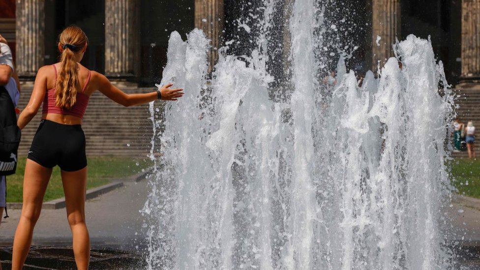 Woman next to a fountain in Germany