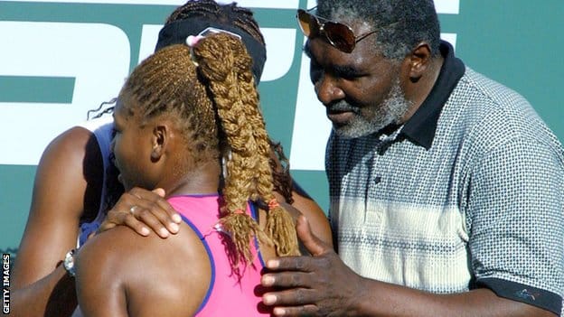 Venus Williams and Richard Williams hug Serena Williams after the 2001 Indian Wells final.