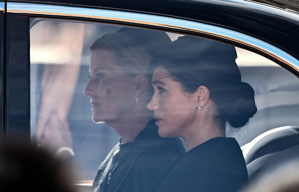 Sophie, Countess of Wessex and Meghan, Duchess of Sussex are driven behind the coffin of Queen Elizabeth II during a procession from Buckingham Palace to the Palace of Westminster, in London on 14 September 2022