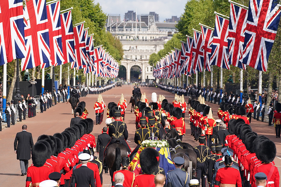 King Charles III and members of the royal family behind Queen Elizabeth II's flag-draped coffin as it is taken in procession on a Gun Carriage of The King's Troop Royal Horse Artillery from Buckingham Palace to Westminster Hall on 14 September 2022