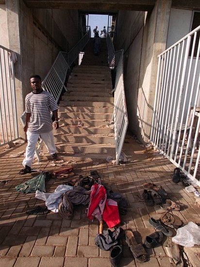 Belongings of the victims of the Ghana 2001 stadium crush lie on the floor