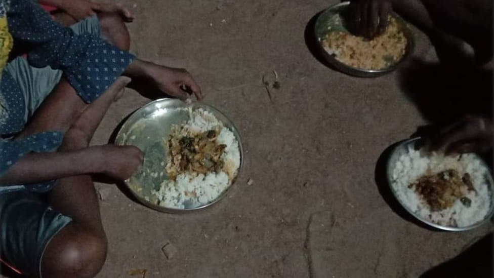 Irula people eating rat meat with rice