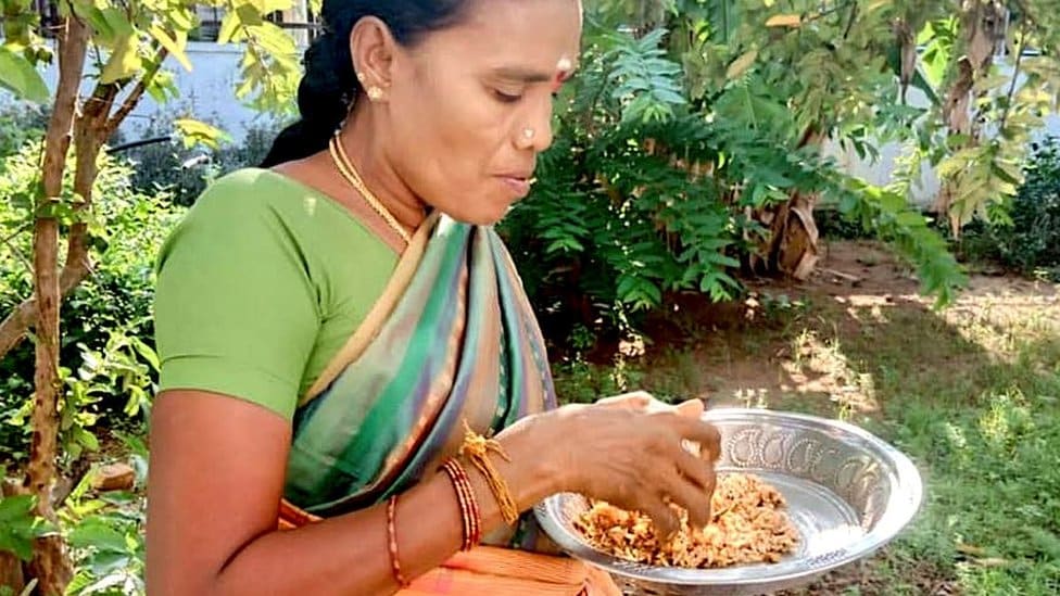 Rani preparing food with rat meat