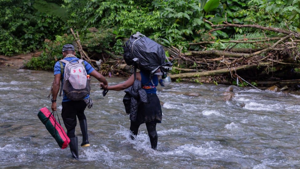migrants, most of them Haitians, cross the dangerous border between Panama and Colombia daily, taking their families with them, children, partners, old men, on October 15, 2021 in Darien, Panama.