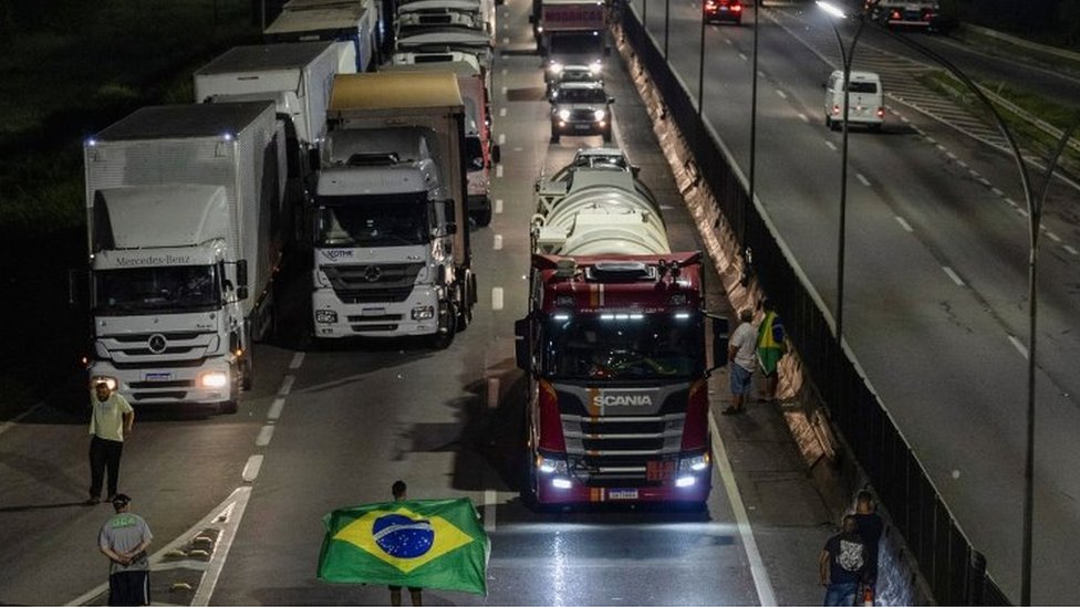 Supporters of Brazilian President Jair Bolsonaro block a road with lorries in Jacareí , São Paulo state. Photo: 31 October 2022