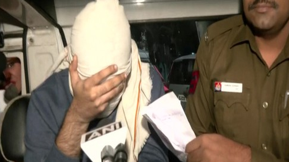 Aaftab Poonawala seen in a police car