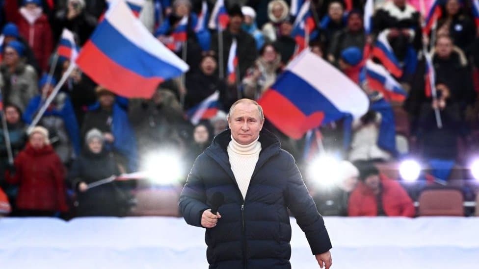 Russian President Vladimir Putin attends a concert marking the eighth anniversary of Russia's annexation of Crimea at the Luzhniki stadium in Moscow on March 18, 2022. (