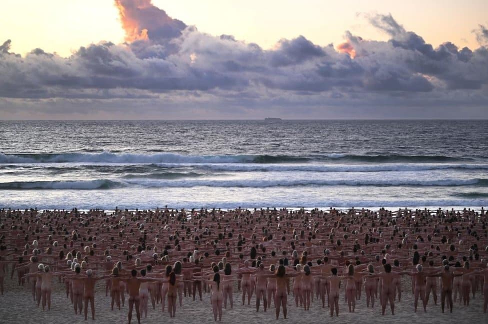 People pose naked on Bondi Beach, Australia