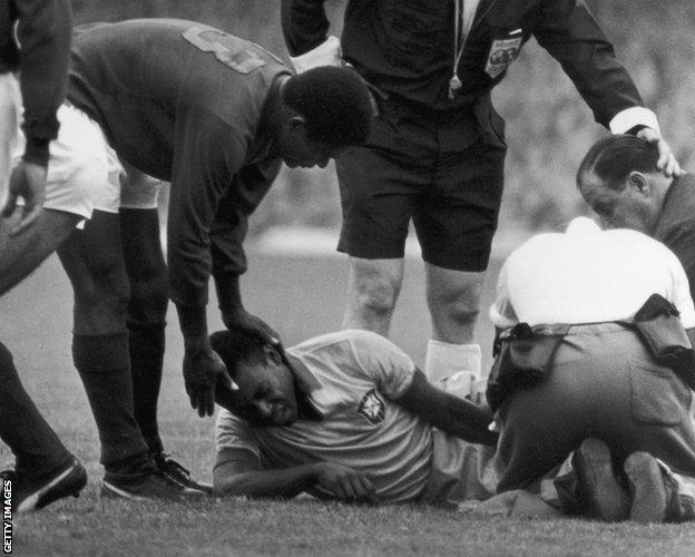 Pele is comforted by Portugal's Eusebio in 1966