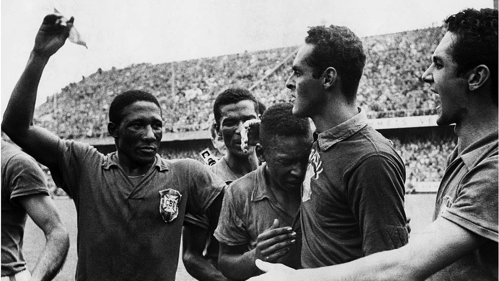 Pele crying while surrounded by his Brazil team mates in 1958