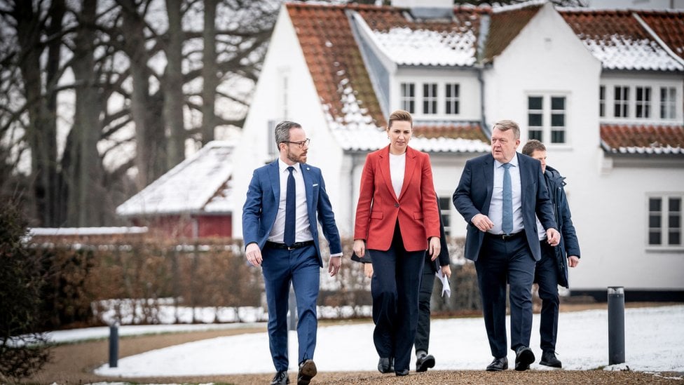 Coalition leaders Jakob Ellemann-Jensen of the Liberal Party, Prime Minister Mette Frederiksen of the Social Democrats and Lars Lokke Rasmussen of the Moderates