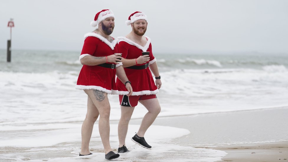 Two men dressed in Santa outfits in Bournemouth, Dorset