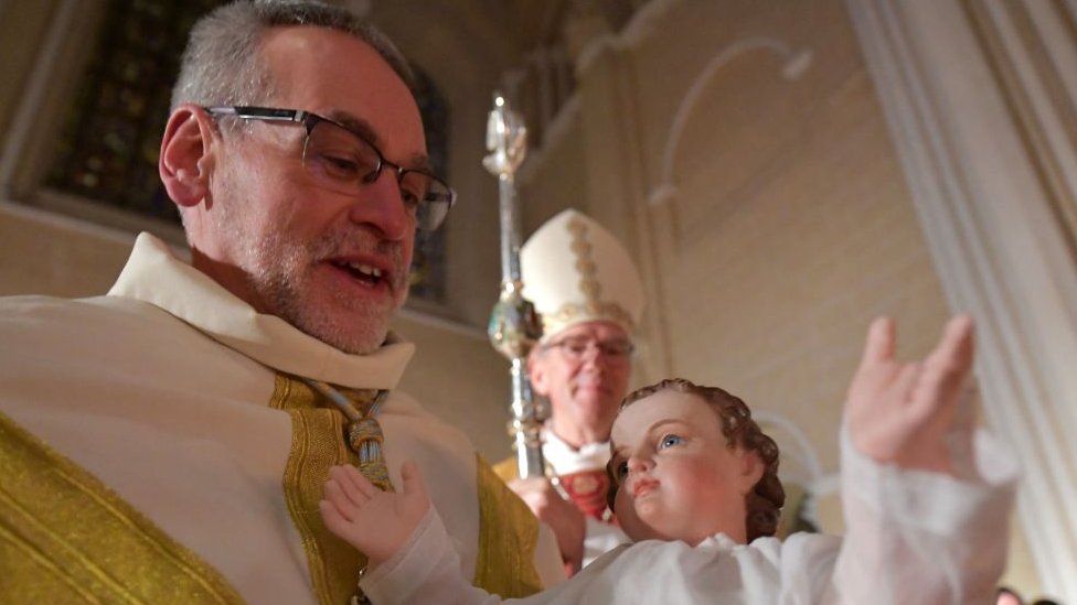 Bishop conducts Christmas mass in France