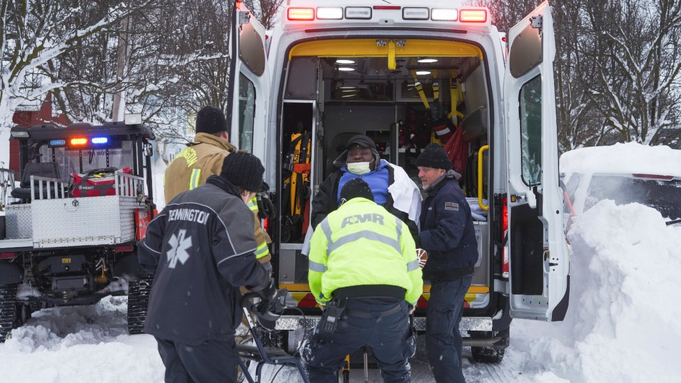 Medics evacuate a man in an ambulance in Wyoming County, New York state. Photo: 26 December 2022