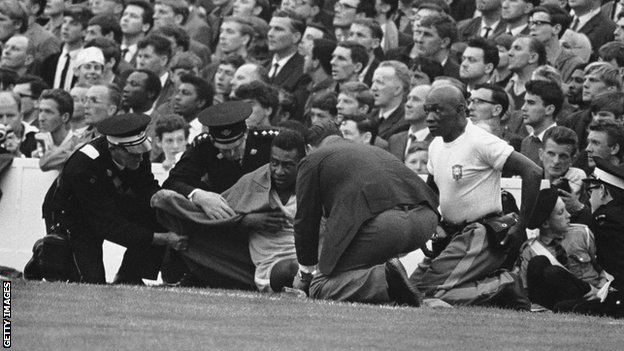 Pele covered in a blanket at Everton's Goodison Park