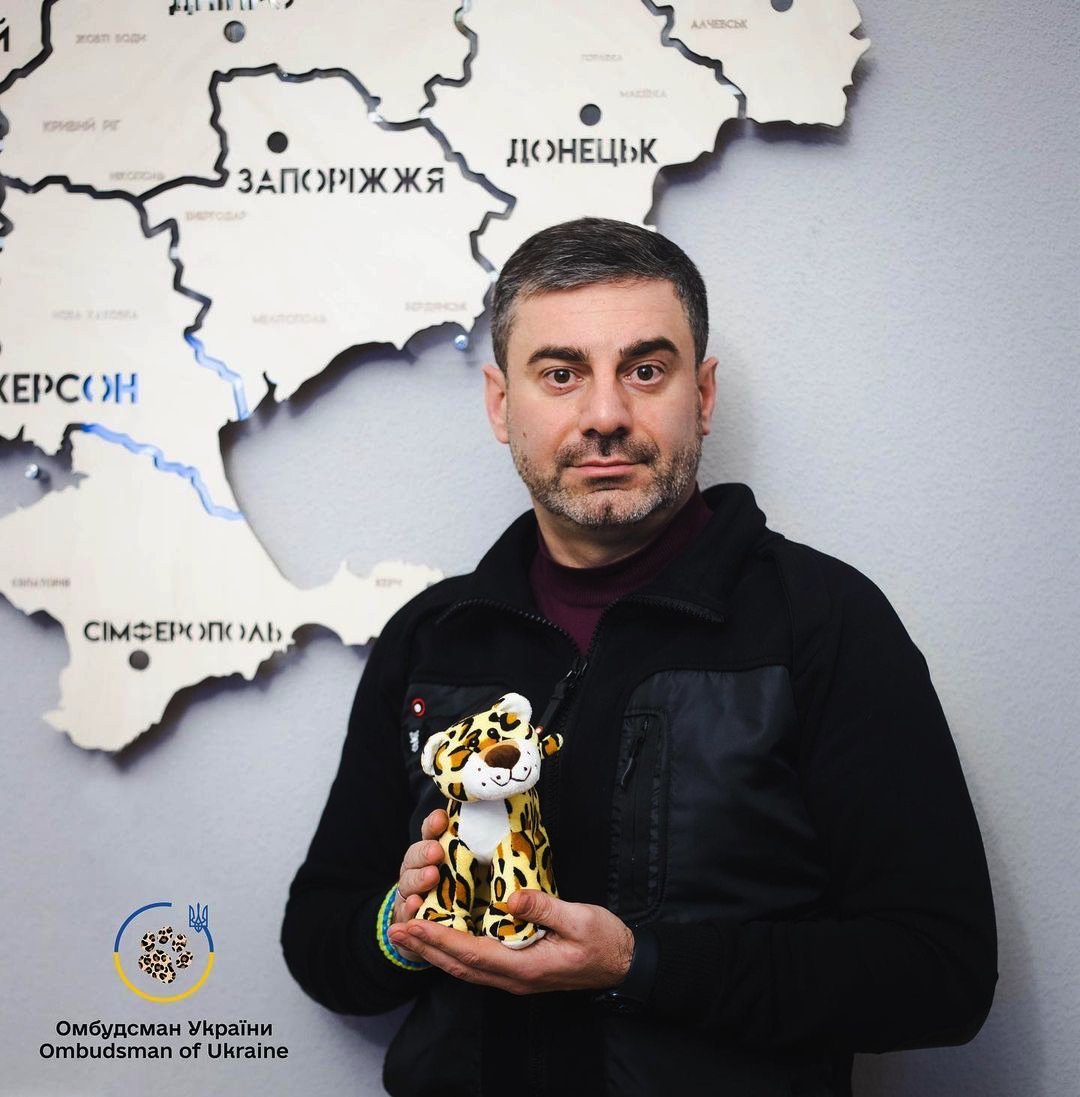 Dmytro Lubinets holding a leopard toy