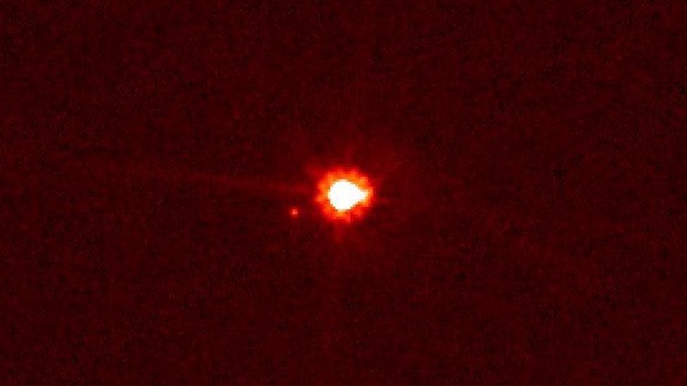 Image of dwarf planet Eris and its satellite Dysnomia captured in 2005 by the Hubble telescope