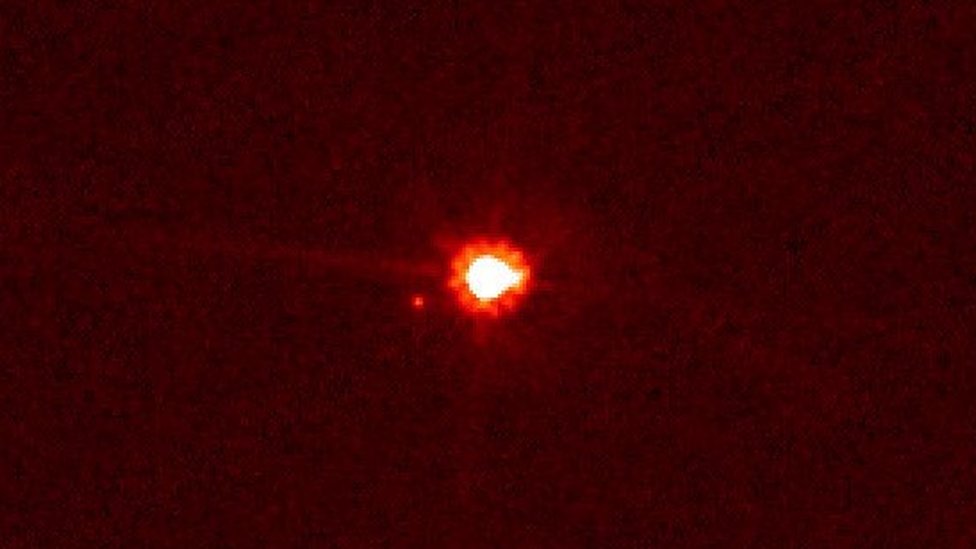 Image of dwarf planet Eris and its satellite Dysnomia captured in 2005 by the Hubble telescope
