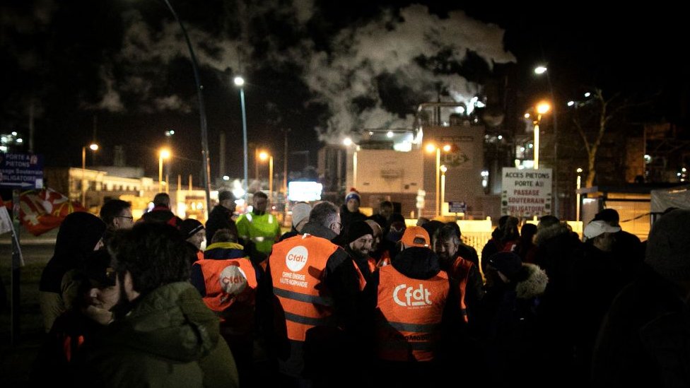 Unionists gather as they take part of a strike vote at the Exxon-Mobil Port Jerome Gravenchon refinery, in Port-Jerome-sur-Seine, near Le Havre, northwestern France, on March 7, 2023
