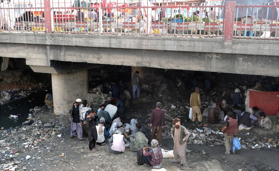 Hundreds of mainly heroin users sit in squalid conditions at Pul-e-Sukhta, under a bridge in western Kabul, Afghanistan, 20 September 20, 2021