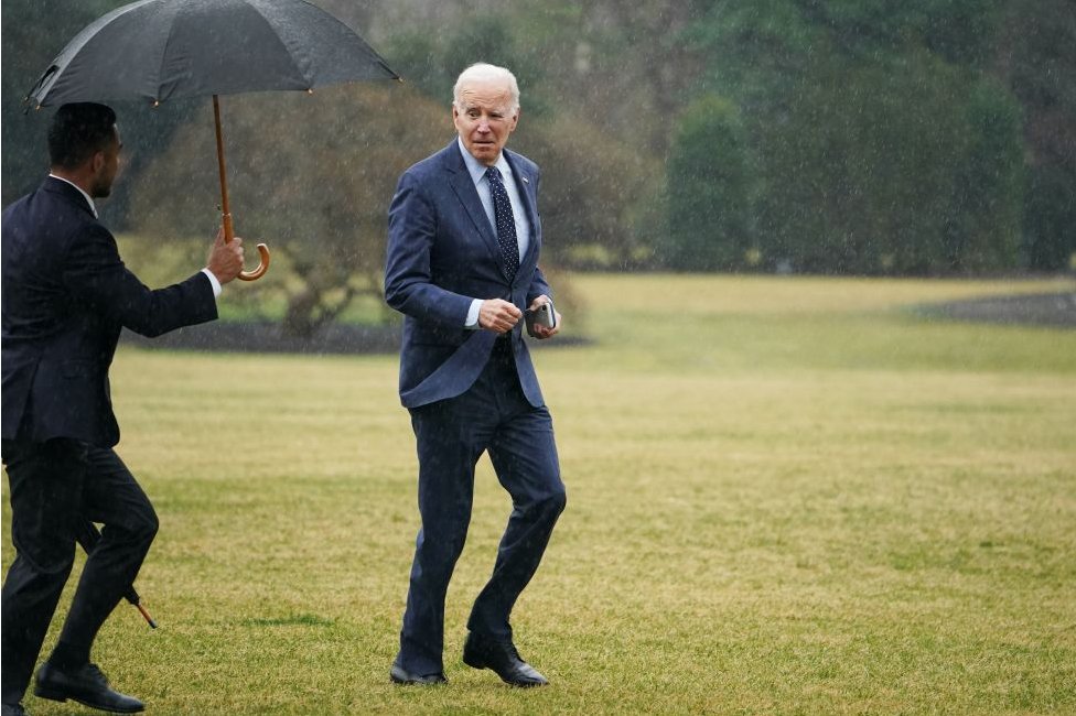 Joe Biden jogs across the White House lawn after returning from his annual medical checkup in February