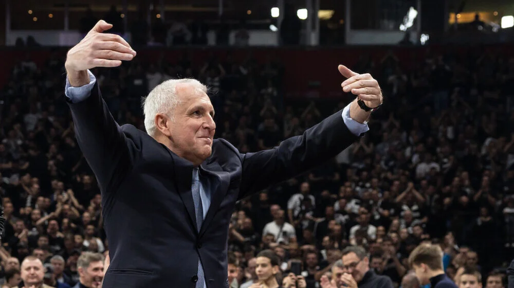 Emotional black and white photo of Željko Obradović on the sidelines.