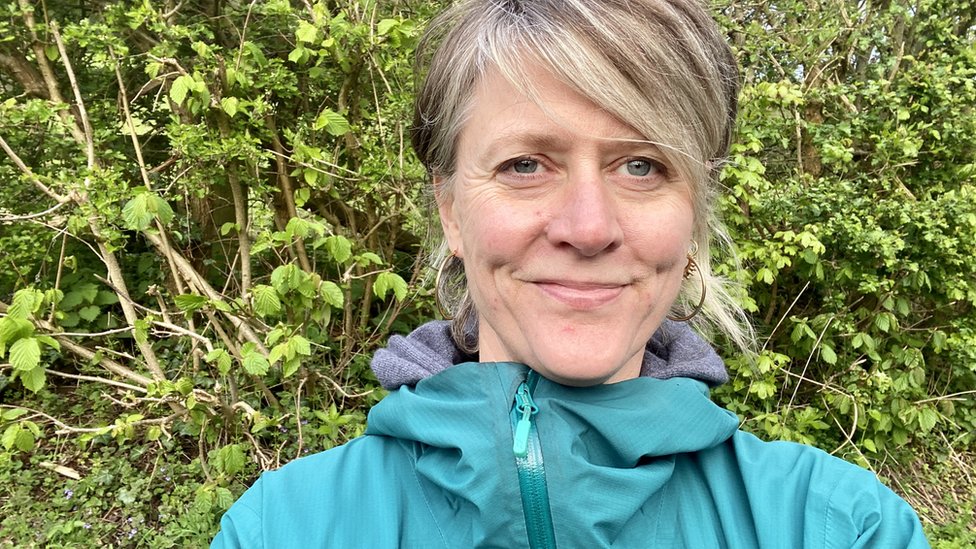 Oli Silverwood-Cope standing in front of plants outdoors