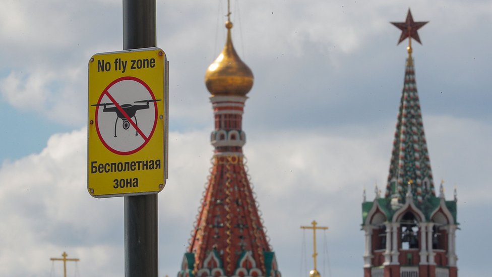 A 'No Drone Zone' sign is seen in front of the Moscow Kremlin on the Red square in Moscow
