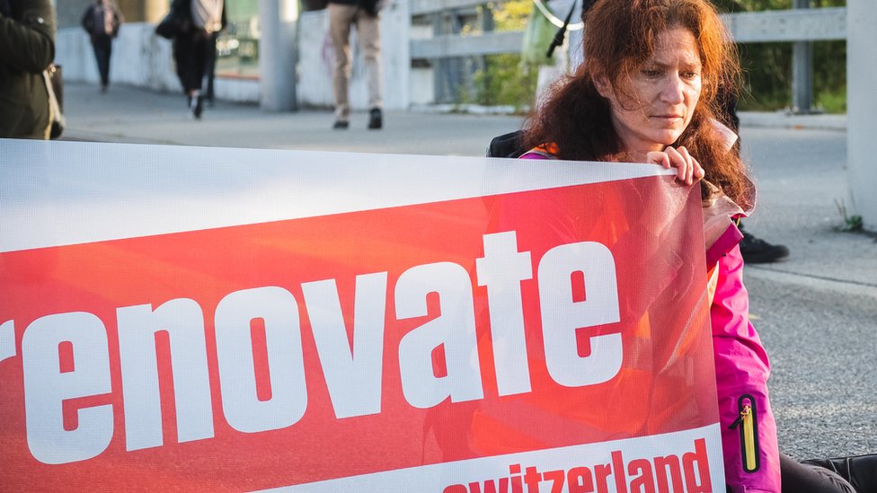 One of the lead authors of latest IPCC report, Julia Steinberger does a sit-in on a motorway in Switzerland
