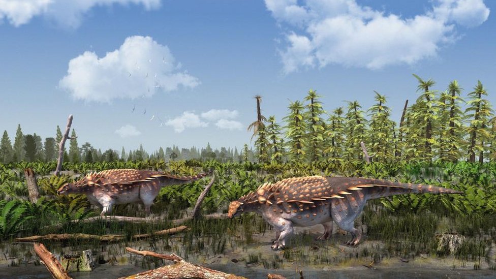 A CGI rendering of two dinosaurs next to a body of water.