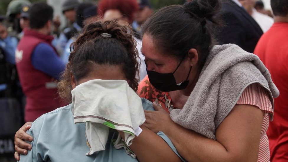The relative of an inmate reacts while another person tries to comfort her as they wait for news about their loved ones outside the Centro Femenino de Adaptacion Social (CEFAS) women's prison following deadly riot in Tamara, on the outskirts of Tegucigalpa, Honduras, June 20, 2023.