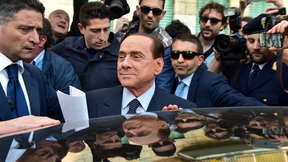 Berlusconi leaves Milan judicial offices in April 2014