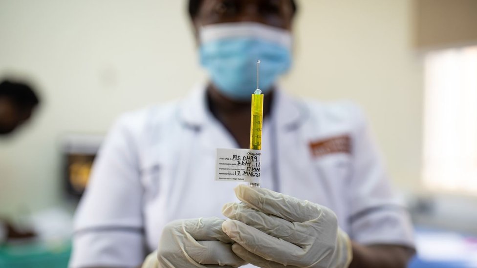 A nurse preparers a trial dose of PrepVacc to inject into a participant on 17 March, 2022 in Masaka, Uganda