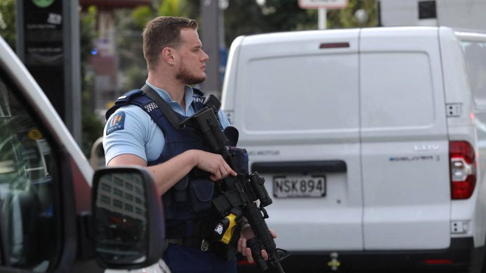 police officer stands guard amid reports of a shooting in Auckland, New Zealand on July 20, 2023