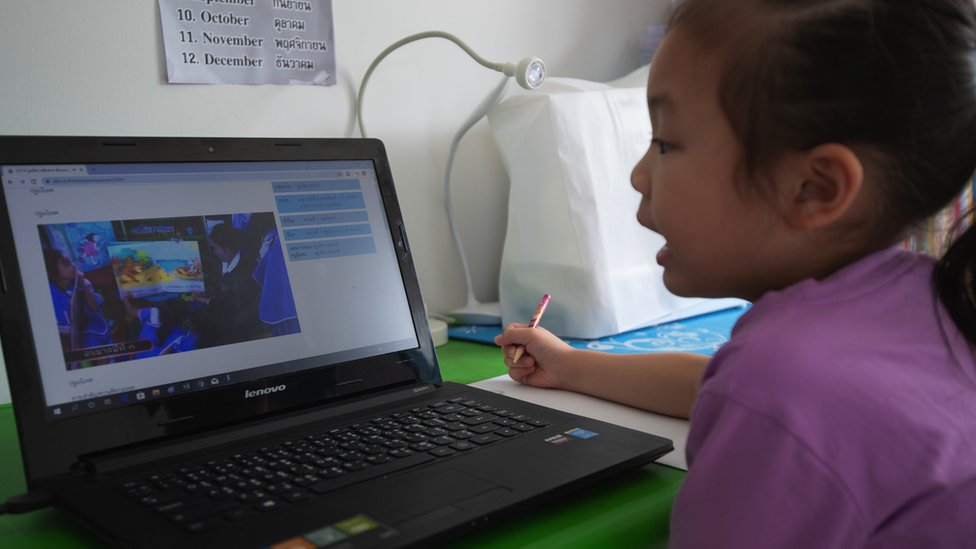 A schoolgirl studying during her online classes via laptop at home on 19 May, 2020 in Nonthaburi, Thailand.