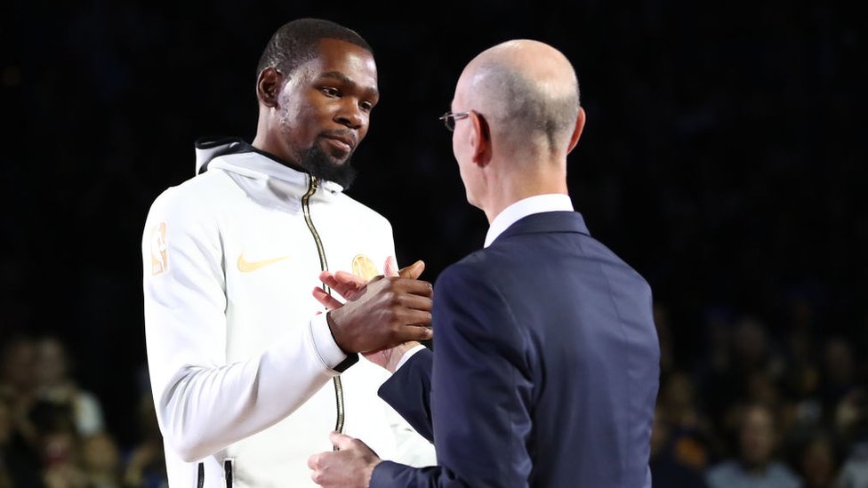 Kevin Durant greets NBA commissioner Adam Silver in October 2018