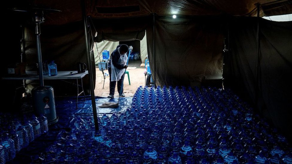 Water bottles in a tent