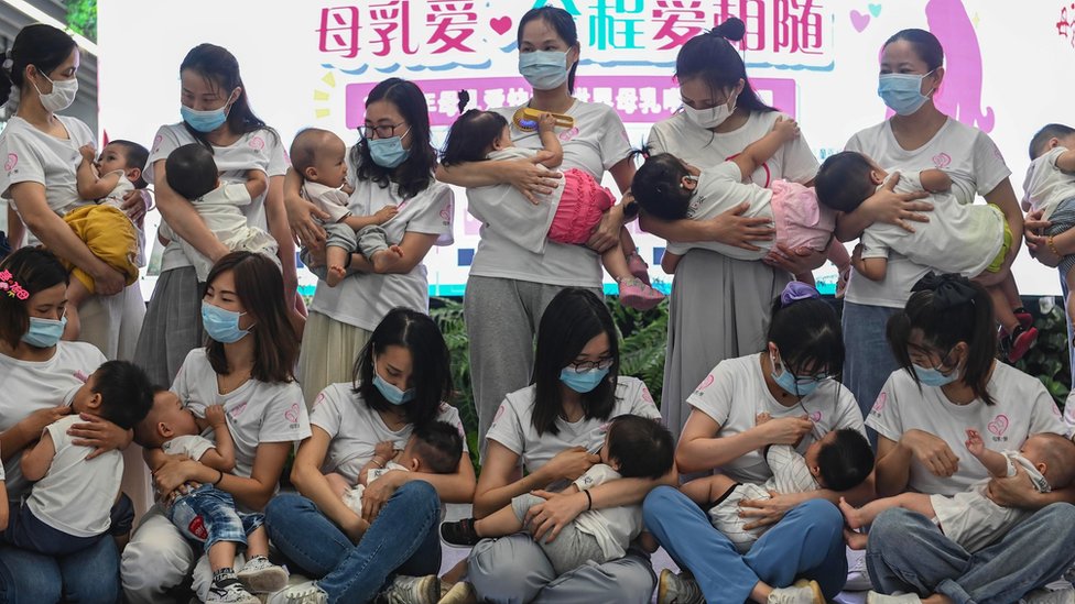 Twenty mothers breastfeed their children during a flash mob event to raise public awareness of breastfeeding at a subway station on 31 July 2020 in Guangzhou, Guangdong Province of China.