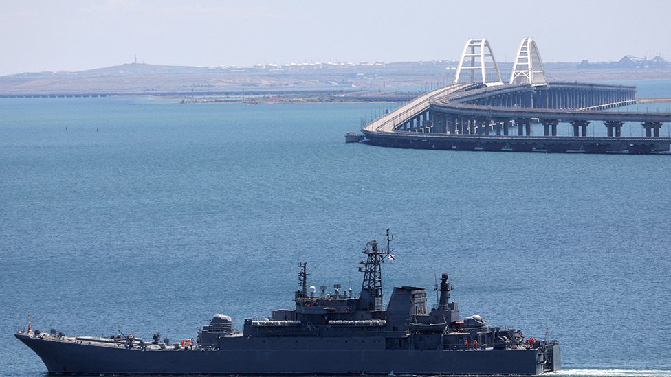 A Russian Navy amphibious landing ship that was deployed to transport cars across the Kerch Strait, moves near the Crimean Bridge