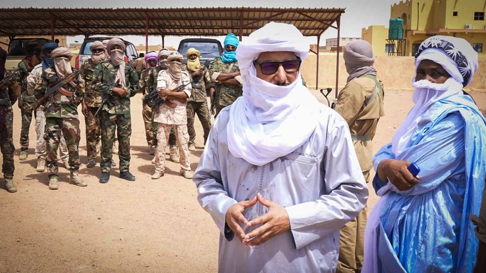 Bilal Ag Sharif, the local Tuareg leader stands in front of some of his troops