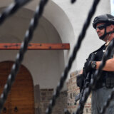 epa10885649 An armed Kosovo Police officer stands guard in front of the Banjska Monastery in the village of Banjska, Kosovo, 27 September 2023. A Kosovar Albanian police officer on 24 September was killed by Serb gunmen who later barricaded themselves in the XIV century Serbian Orthodox Banjska monastery and traded gunfire for hours, Kosovo authorities confirmed. Police regained control of the area late on the same day. The incident came at a fragile moment in the Kosovo - Serbia European Union-facilitated dialogue to normalize ties between the two parties.