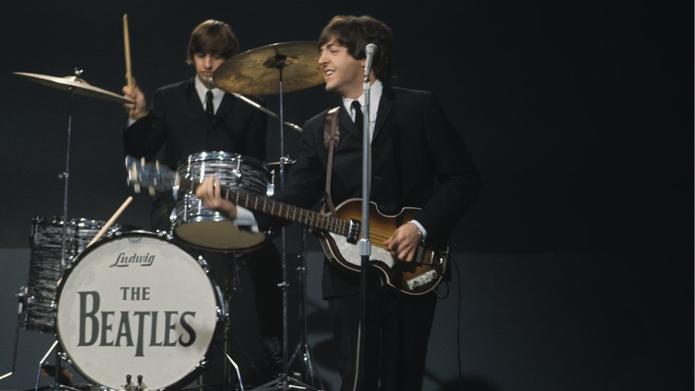 Ringo Starr and Paul McCartney (playing a Höfner 500/1 violin bass guitar) on stage during recording of the American Broadcasting Company (ABC) music television show 'Shindig!' at Granville Studios in Fulham, London on 3rd October 1964