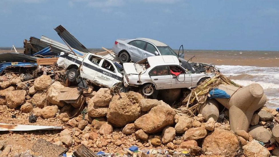 Cars abandoned on rocks after floods