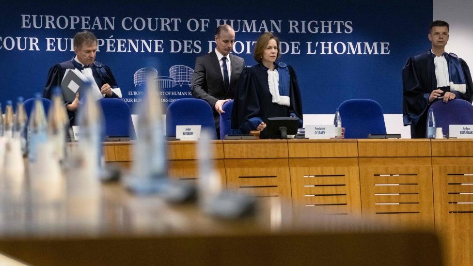 Irish chairman of ECHR, Siofra O'Leary (C) and Slovenia judge Marko Bosnjak (R) arrive for the European Court of Human Rights hearing in two climate change cases involving France and Switzerland, on March 29, 2023 in Strasbourg, eastern France.