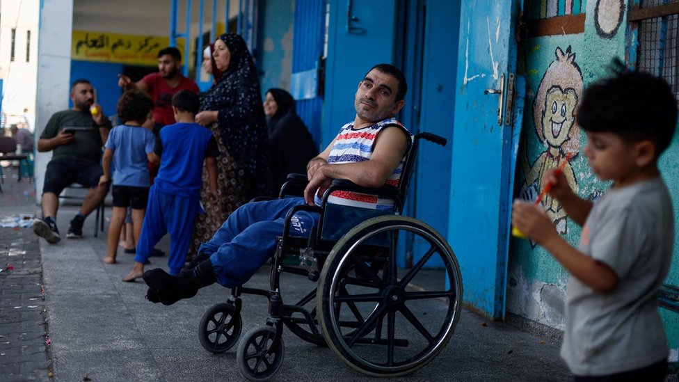 Palestinians who have fled their homes take shelter in a UN school in Gaza City (8 October 2023)