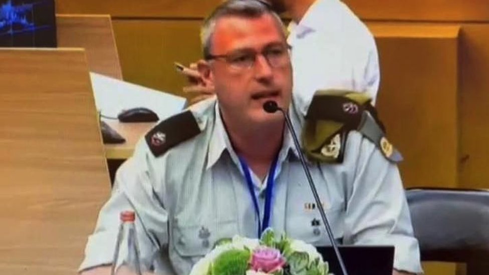 Rafael speaking into a microphone