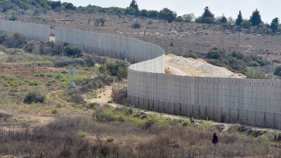 A general view of the wall at the Israeli-Lebanon border, seen from the Dhayra village, southern Lebanon, 10 October 2023.