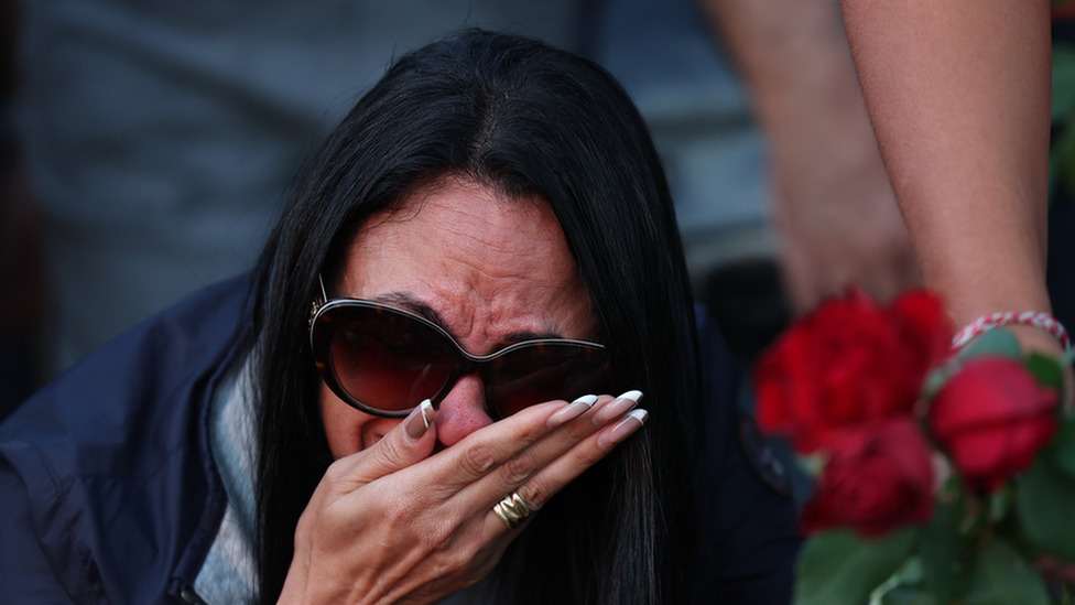 An Israeli woman mourning victims of a Hamas attacks