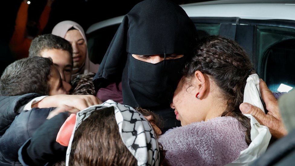 Family members hug released Palestinian prisoner Fatima Amarneh